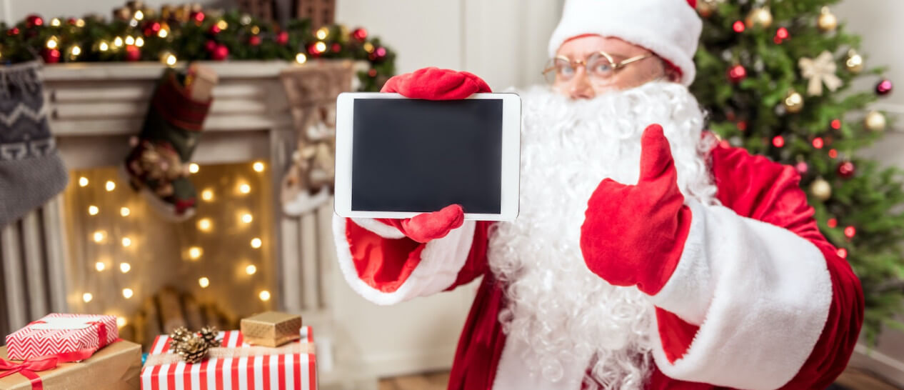 Santa Claus holding tablet