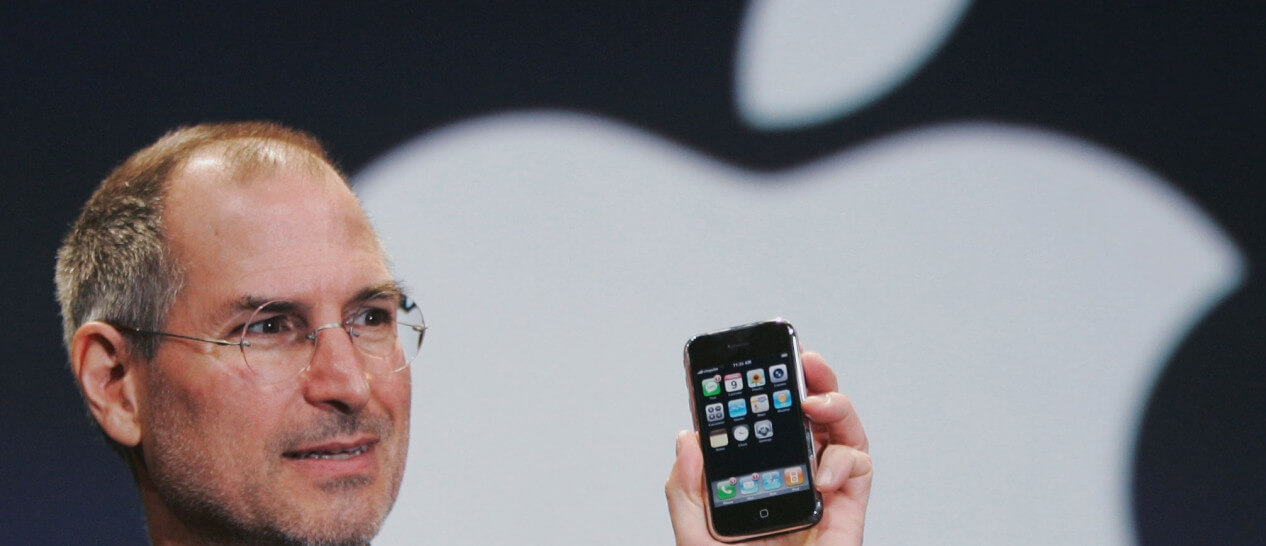 Steve Jobs holding iphone