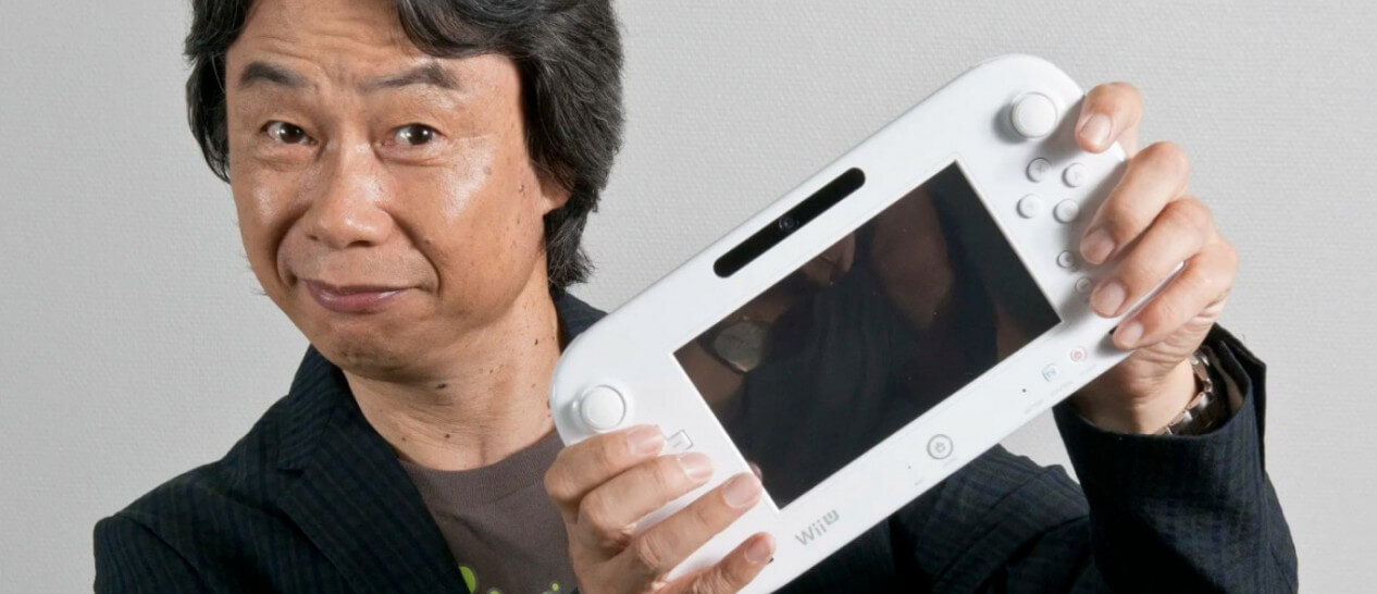 guy holding white Wii U