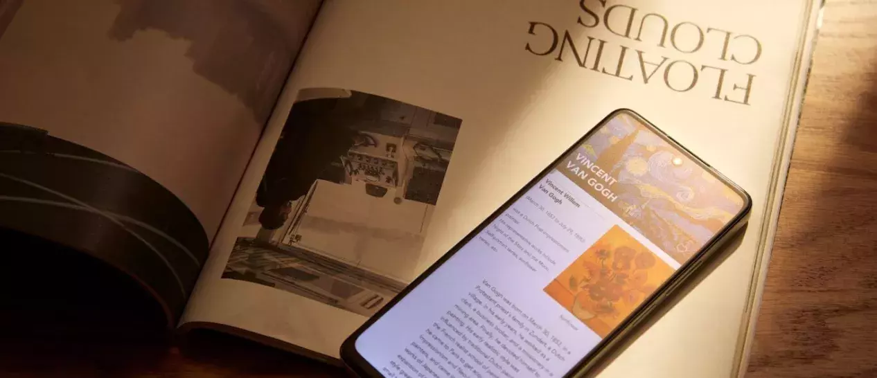 TCL 40 NXTPAPER on top of an open book