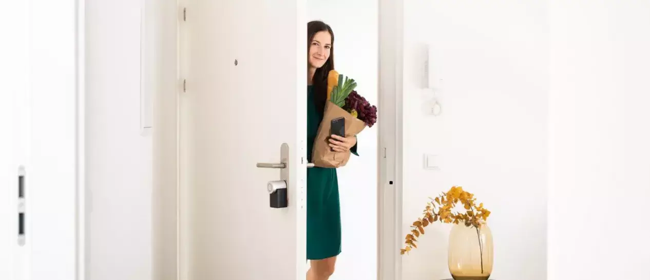 woman using smart lock door