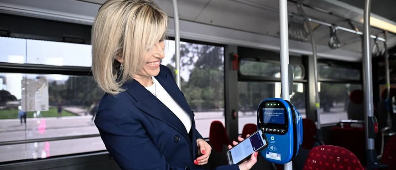 woman pays contactless public transport ticket