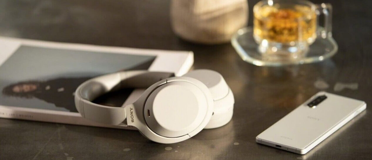 white sony dsee headphones on table