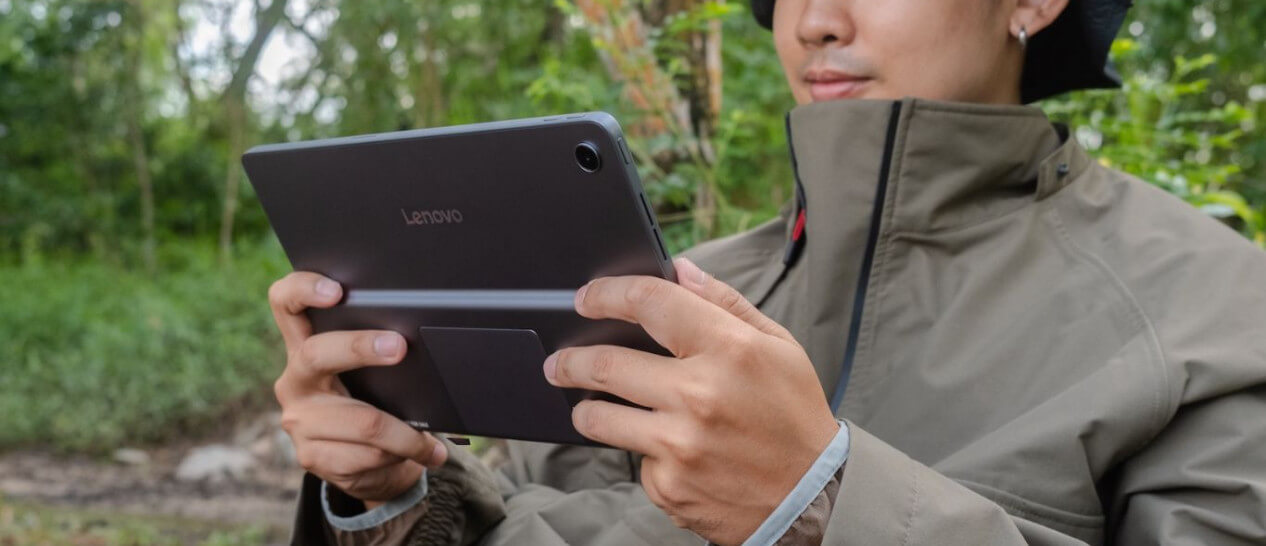 guy using LENOVO Tab Plus