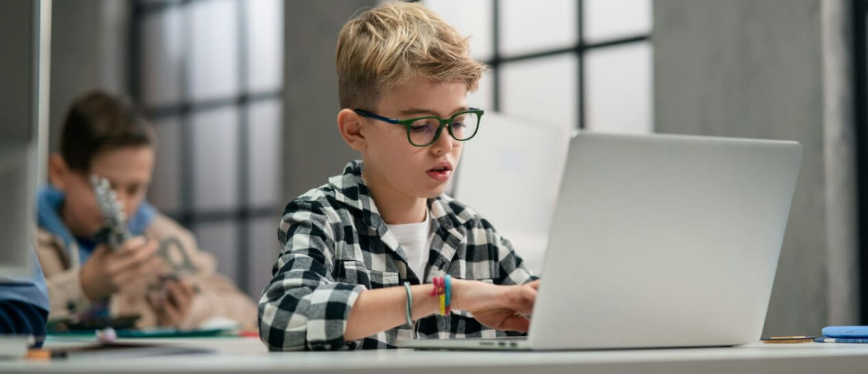 kid at school with laptop