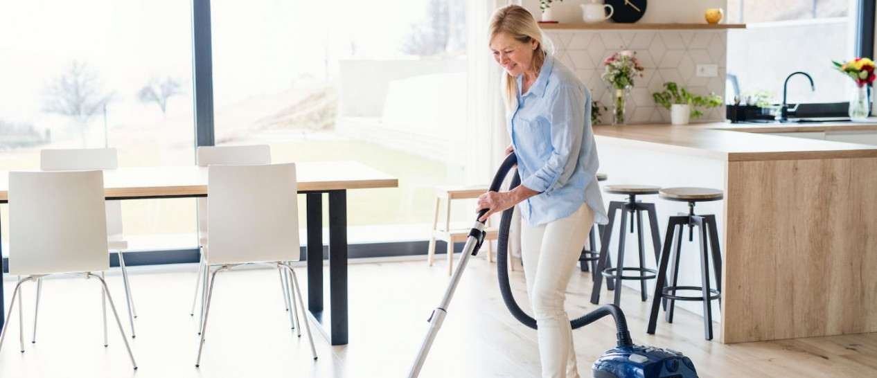 woman using vacuum cleaner