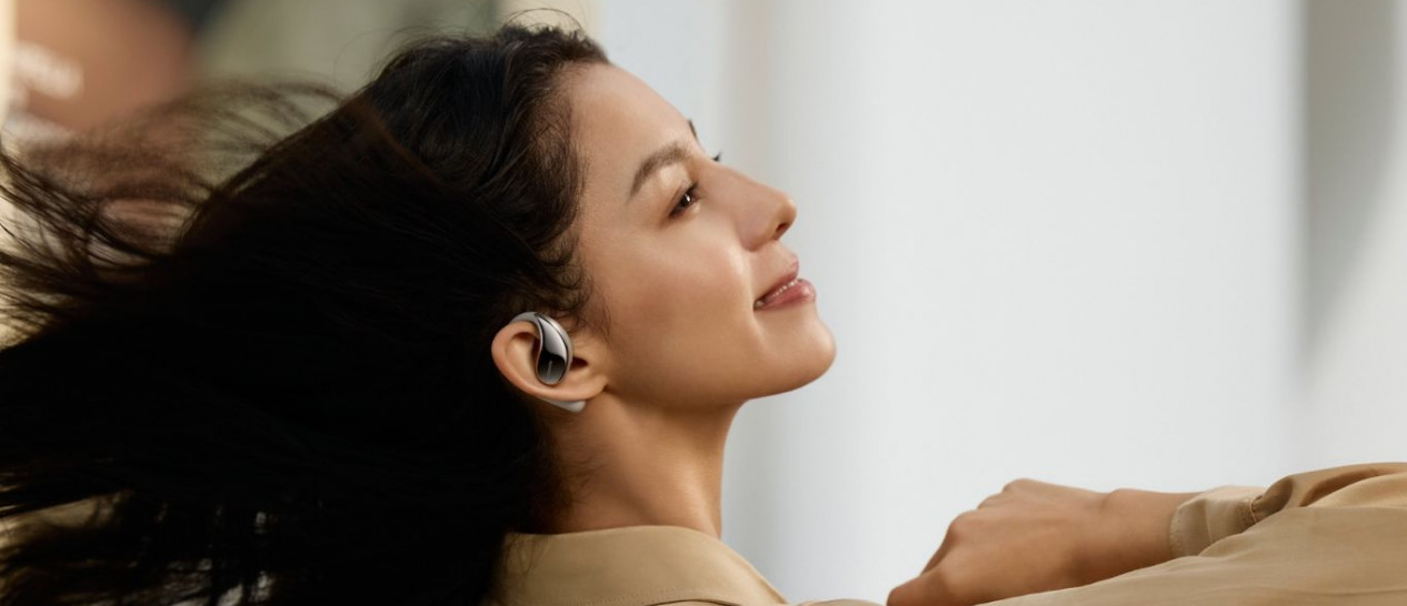 woman with xiaomi open wear earphones