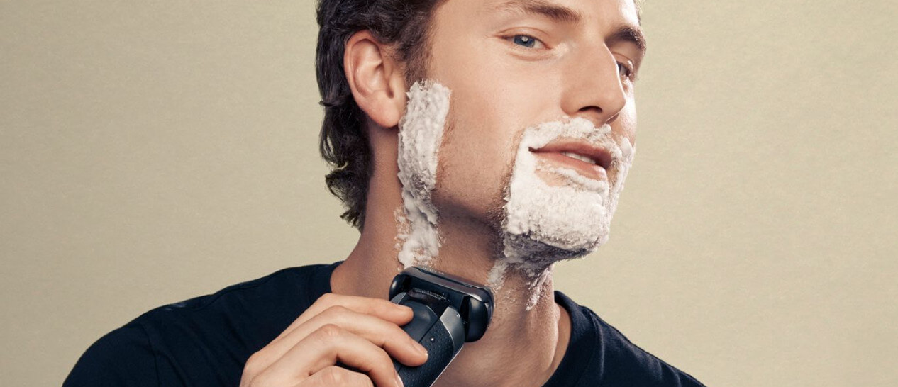 guy using hair-beard shaver