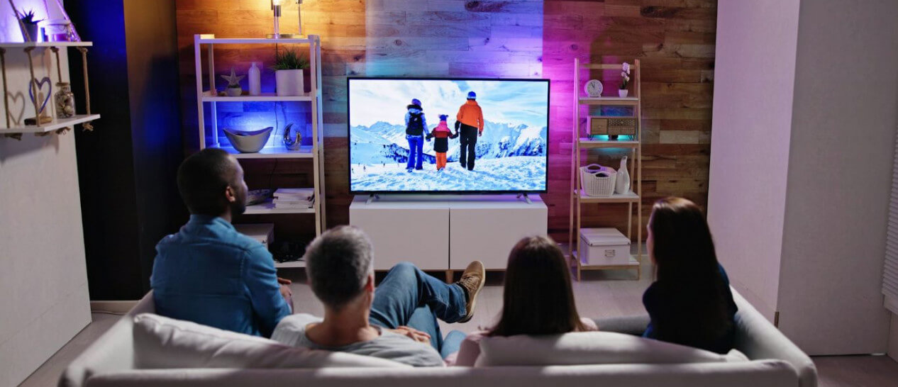 family watching tv in living room