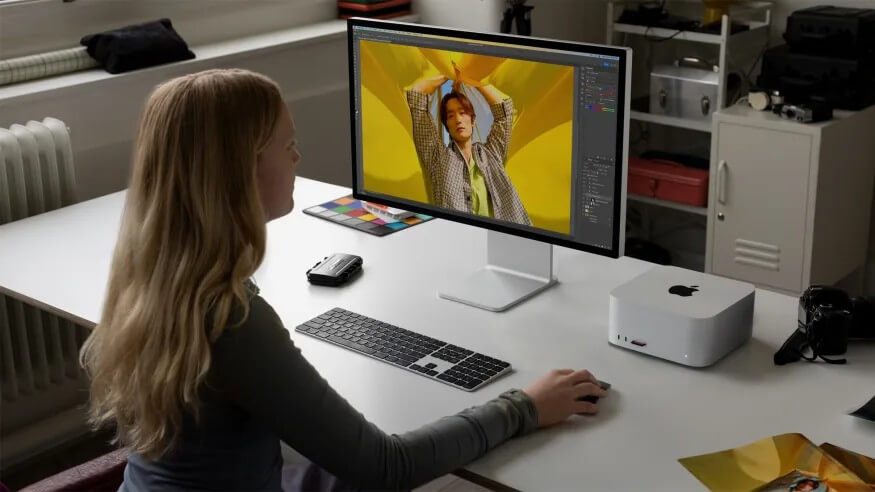 woman using APPLE Mac Studio