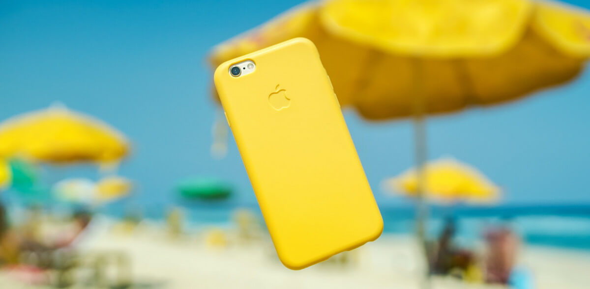 yellow iphone in beach