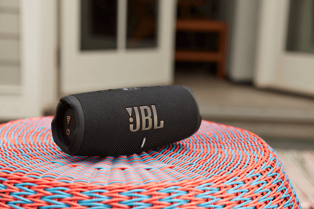JBL Charge 5 WiFi on red table