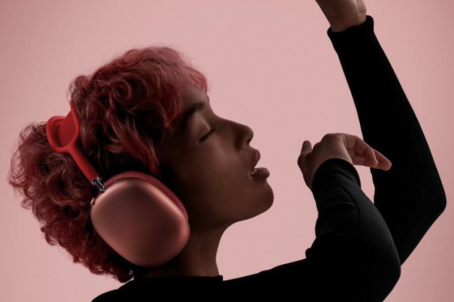 redhead woman wears pink airpods max pro