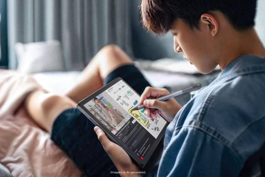 young boy using lenovo tab m 11 watching video taking notes with tab pen