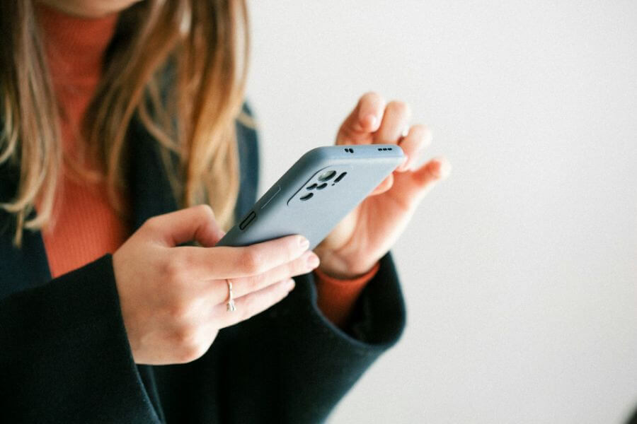 young mother texting in smartphone