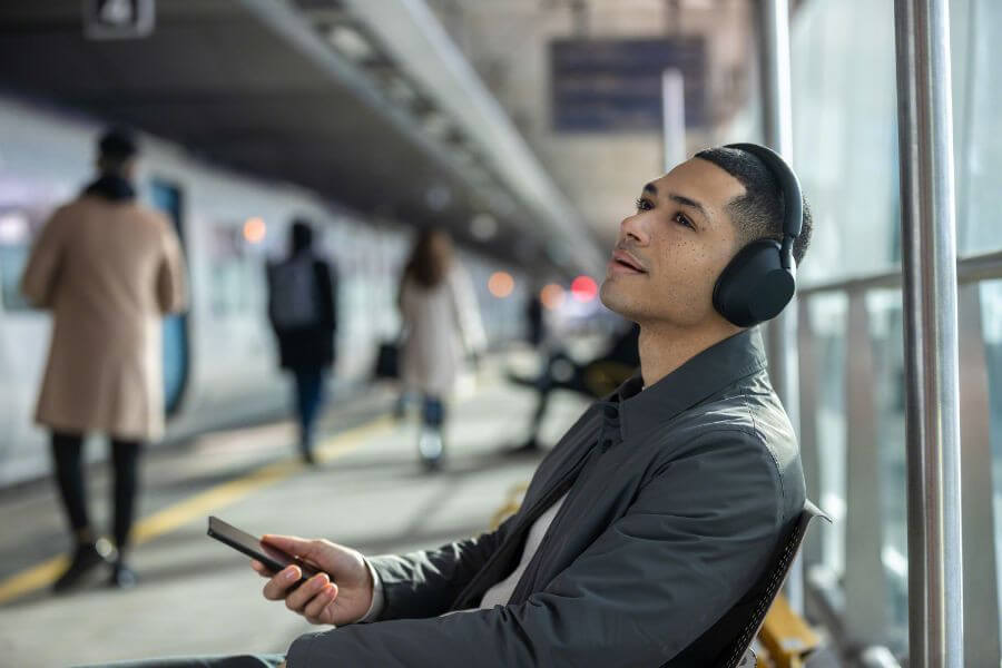 guy at airport with sony hi-res headphones