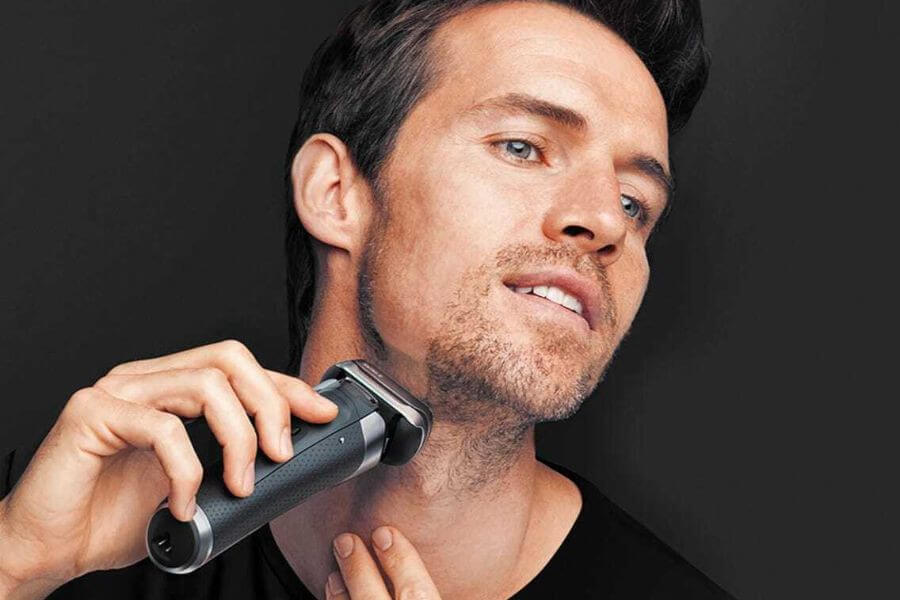 guy shaving with electric shaver